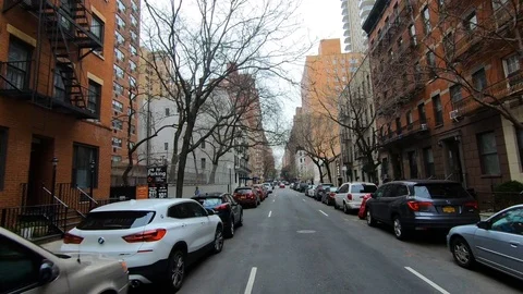 Driving in NYC tree lined block Stock Footage 106403154