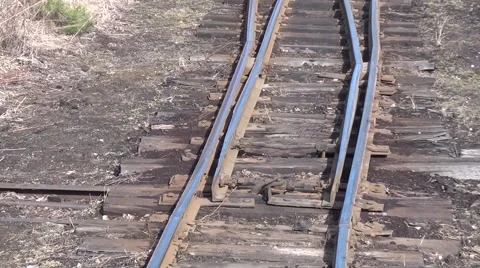 Driving an old railway - operator manually switches the railway switch Stock Footage 41955113