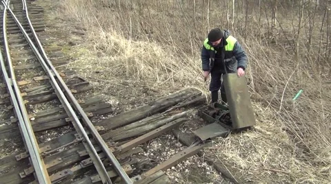 Driving an old railway - operator manually switches the railway switch Video stock 41955407