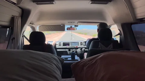 Driving on an open road in a camper van with a passenger Stock-Footage 326352291