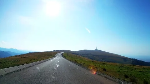 Driving on an open road on a mountain peak Stock Footage 71490864