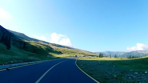 Driving on an open road in a valley in the mountains Stock Footage 71490602