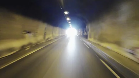 Driving out of a tunnel into the mountains Stock Footage 253303110