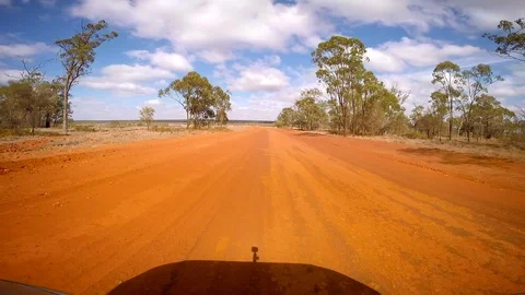 Driving in the outback of Australia through red dirt from front window Stock Footage 119997555