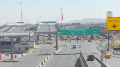 Driving Over a Bridge Looking Down at the US and Mexico Border Stock Footage 60630656