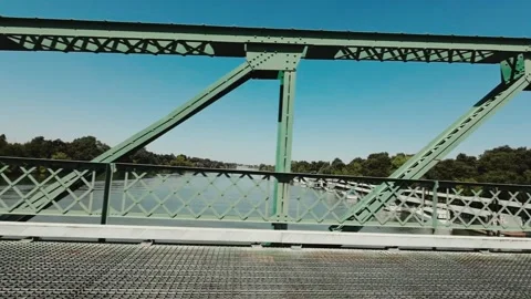 Driving over a green bridge Stock Footage 296214442