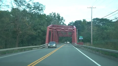 Driving over small bridge POV Видео 96402084