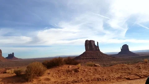 Driving pan view on a red sand and mountains at a navajo desert, at monumen.. Stock Footage 71642344
