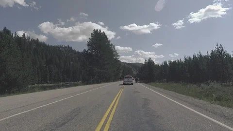 Driving passing through a Bison 2.7k Ultra HD gopro Stock Footage 98574525