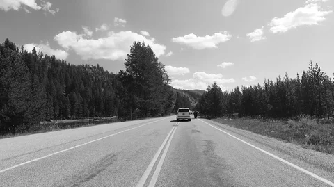 Driving passing through a Bison 2.7k Ultra HD gopro Stock Footage 98575444