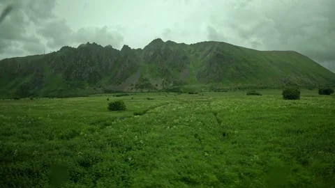 Driving past 40 speed limit sign and green mountains in Andoya Norway Video stock 343131150