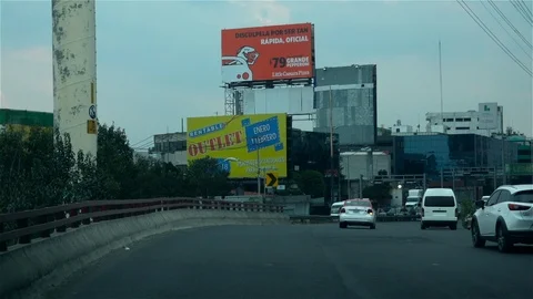Driving past billboards Stock Footage 124310445