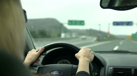 Driving past blinking orange traffic signal Stock Footage 33064087