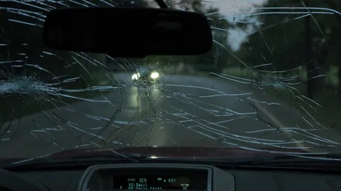Driving Past Caution Sign Through Severely Cracked Windshield Video stock 322712090