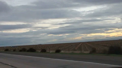 Driving Past Farmland and Semi Stock Footage