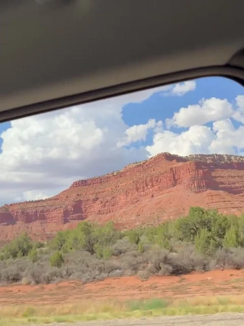 Driving Past Massive Red Rock Cliffs and Desert Road Video stock 342268501