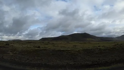 Driving past mossy lava fields and green hills in Iceland, 4K POV Stock Footage 335000710