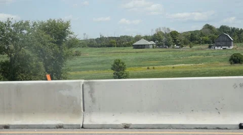 Driving past old barn and field Stock Footage 68443409