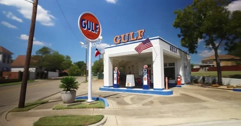 Driving Past Old Gulf Gas Station in Waco Texas Stock Footage