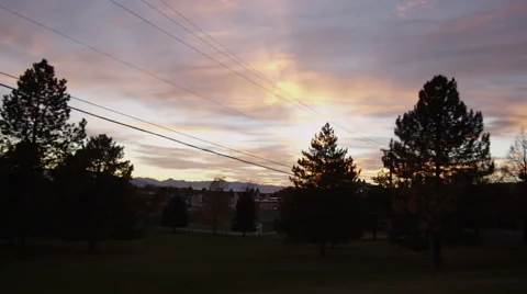 Driving past park with sunset in the background Video stock 52499784