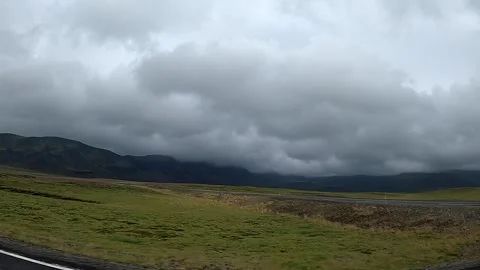 Driving past a scenic road intersection in the Icelandic countryside, 4K Stock Footage 335000716