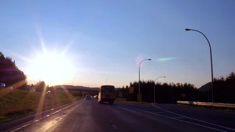 Driving past a schoolbus at sunset 스톡 동영상 92393639