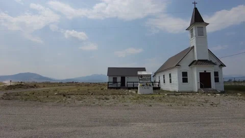 Driving past small old white church Stock Footage 168151573