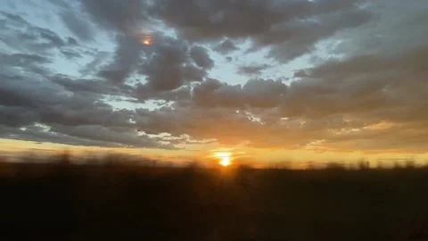 Driving past a sunset Stock Footage 153410965