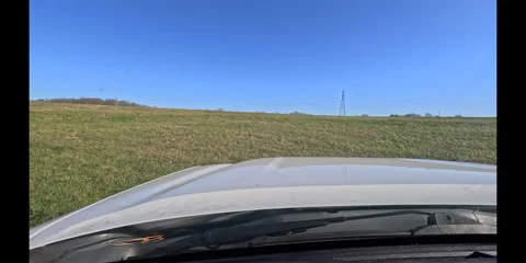 Driving Past A Tree In A Pasture Towards Up A Hill Stock Footage 297007616