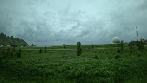 Driving past white radar dome at Andoya Space research facility in Norway Stock-Footage 343131076