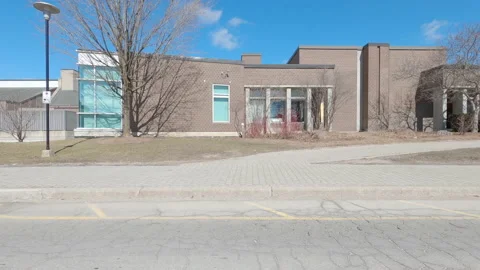 Driving plate of empty university and college campus in COVID pandemic Stock Footage 150485359