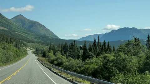 Driving Plate On Open Road Summer Green Forest Mountain Yukon Stock Footage 80716367
