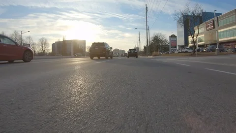 Driving plate POV low angle through the city of Toronto streets Stock Footage 101216841