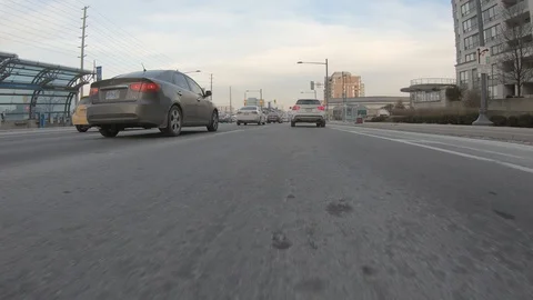 Driving plate POV low angle through the city of Toronto streets Stock Footage 101216976