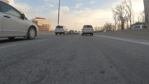 Driving plate POV low angle through the city of Toronto streets Stock Footage 101217587