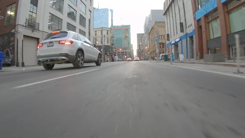 Driving plate POV low angle through the city of Toronto streets Stock Footage 101218792