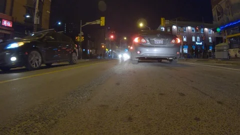 Driving plate POV low angle through the city of Toronto streets Stock Footage 101220707
