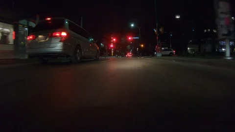 Driving plate POV low angle through the city of Toronto streets Stock Footage 101221225