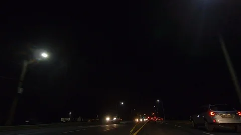 Driving plate POV low angle on Toronto city streets and highways at night Video stock 120151962