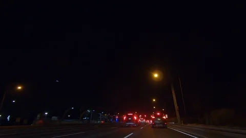 Driving plate POV low angle on Toronto city streets and highways at night Stock Footage 120153244