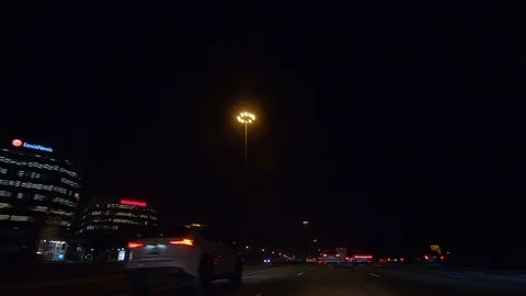 Driving plate POV low angle on Toronto city streets and highways at night Stock Footage 120154943