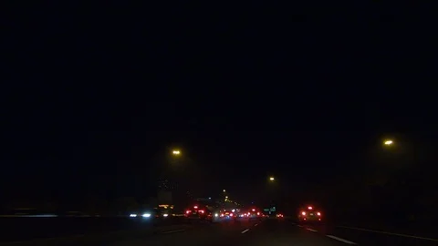 Driving plate POV low angle on Toronto city streets and highways at night Stock Footage 120157335
