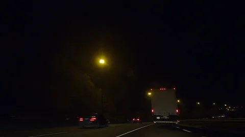 Driving plate POV low angle on Toronto city streets and highways at night Stock Footage 120158579
