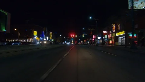 Driving plate POV low angle on Toronto city streets and highways at night Vidéo 120163080