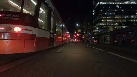 Driving plate POV low angle on Toronto city streets and highways at night Stock Footage 120164971