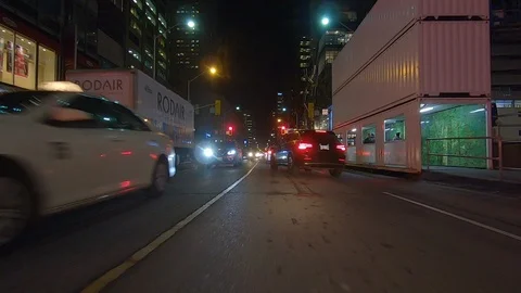 Driving plate POV low angle on Toronto city streets and highways at night Stock Footage 120170536