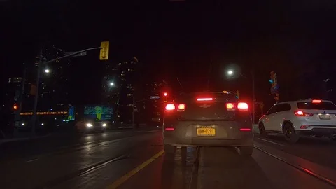 Driving plate POV low angle Toronto dark city streets at night downtown urban Stock Footage 122028714