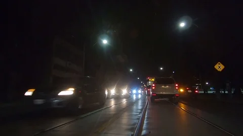 Driving plate POV low angle Toronto dark city streets at night downtown urban Stock Footage 122029615