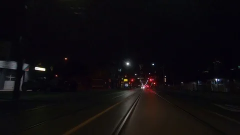 Driving plate POV low angle Toronto dark city streets at night downtown urban Stock Footage 122030585