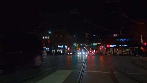 Driving plate POV low angle Toronto dark city streets at night downtown urban Stock Footage 122030858